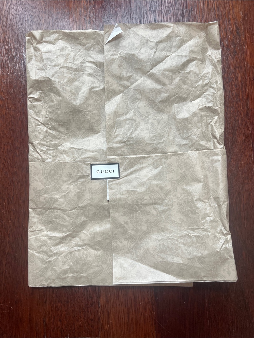 Gucci tissue paper with sticker logo